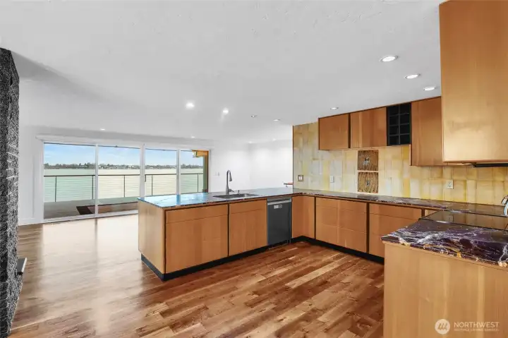 Expansive picture windows framing panoramic lake views