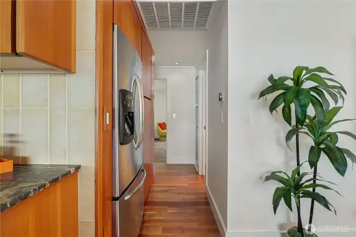 Hallway leading to bedrooms creates a natural separation of living spaces for added privacy