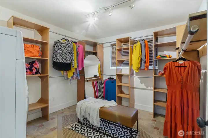 Spacious dressing room/closet offering ample storage and organization close to bedrooms