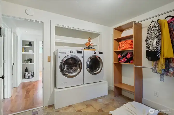 Dedicated laundry space with added storage for everyday convenience and functionality