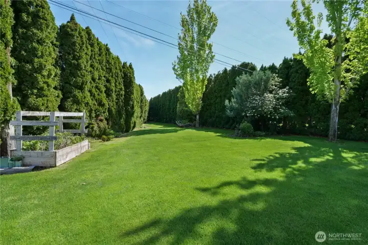 Lush, green lawn and refreshed landscaping create incredible curb appeal