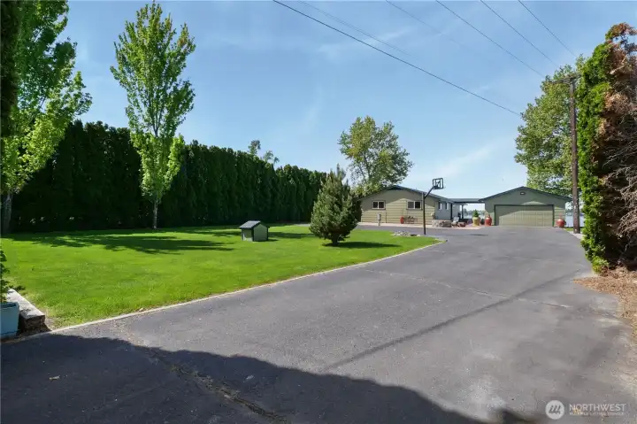 Peaceful setting with mature trees offering privacy and shade