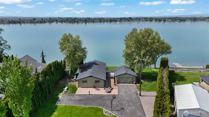 Long driveway with ample parking for guests, RVs, and lake toys