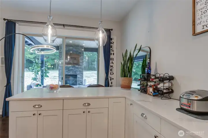 Dine/serve peninsula is steps away from the covered patio