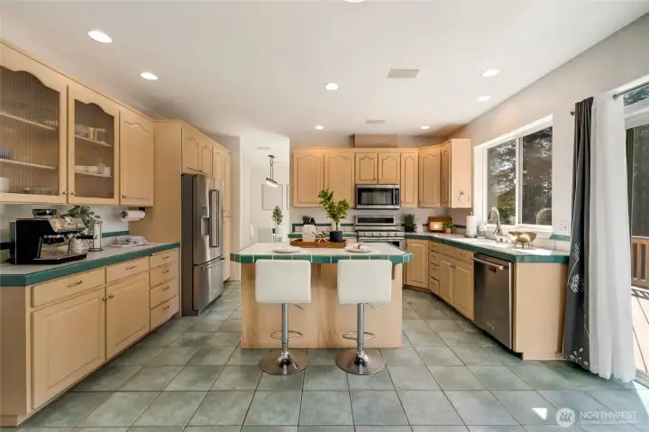 The open-concept kitchen serves as the heart of the home, built for connection and everyday living.