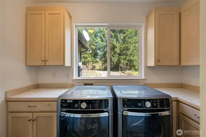 This huge utility room is a dream for organization, offering ample storage for everything from seasonal gear to everyday essentials. Thoughtfully designed, it keeps clutter out of sight while making chores effortless.