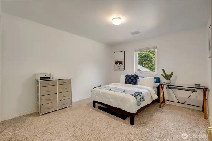 Generously sized secondary bedrooms offer flexibility for guests, hobbies, or multi-generational living.