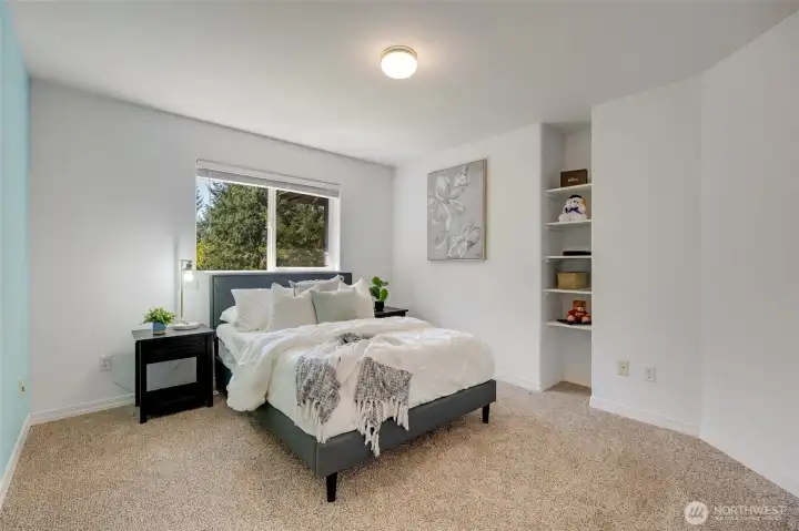 Natural light creates warm, inviting environments throughout this bedroom.