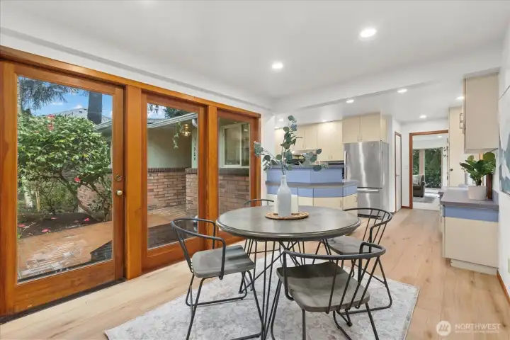 kitchen nook with doors onto front patio