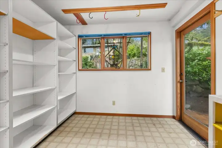 storage room off of kitchen for bikes and gear.