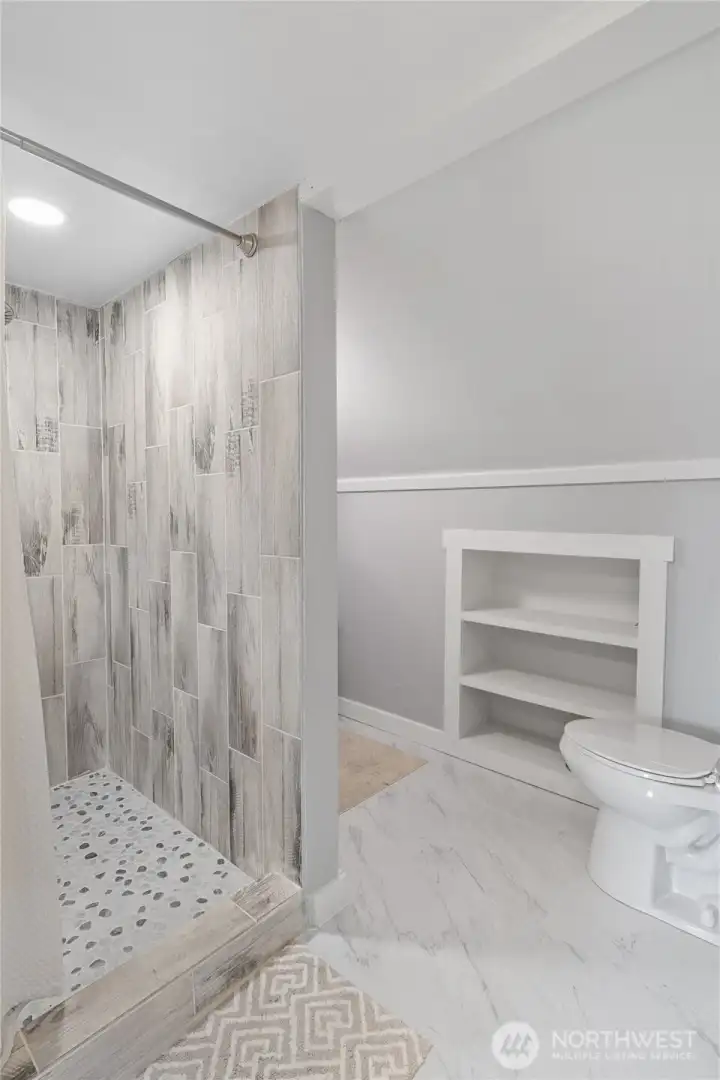 Tiled shower in 3/4 bath upstairs