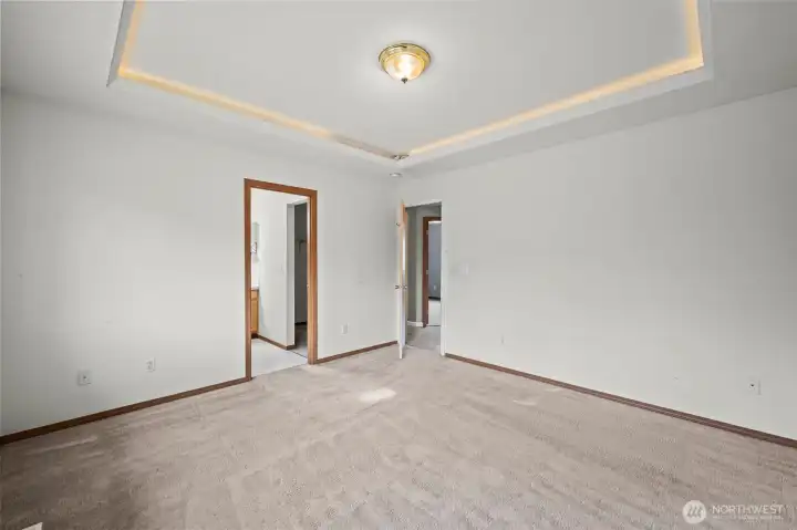 Primary bedroom upstairs with coved ceilings and LED lighting