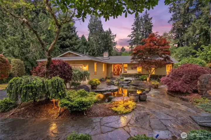 1-story rambler on almost a half acre of mature Japanese style gardens including a Koi pond.