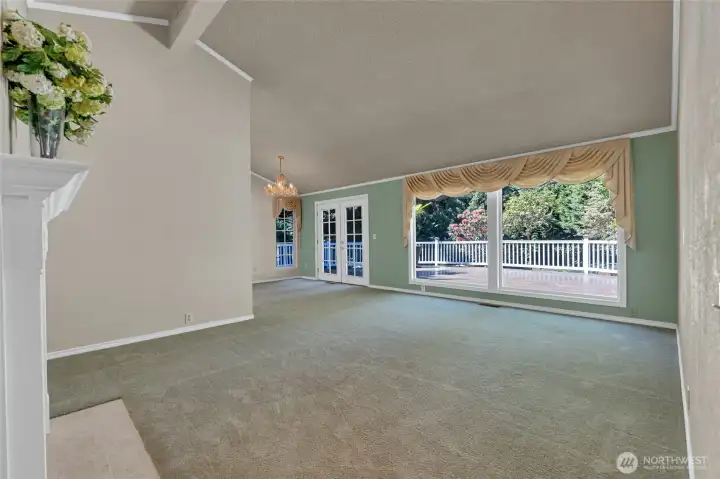No staging. Large picture windows and French doors in the dining room lead out to the deck.
