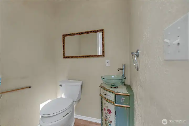 Half bath located just off the kitchen.