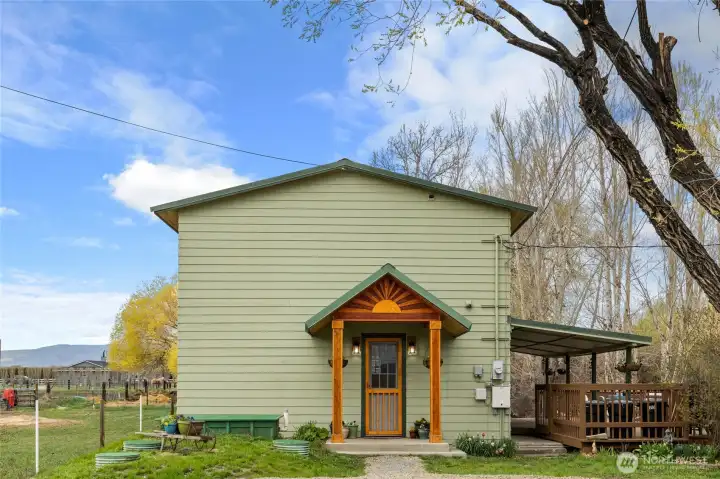 Welcome to the home through a stunning handcrafted woodwork entrance—a true piece of art that sets the tone for what’s inside.