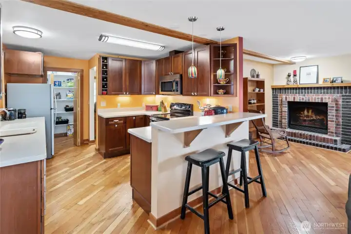 Another view of the kitchen highlights the convenient eating bar—perfect for casual meals or entertaining.