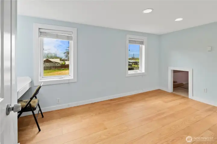 Bedroom #2 is light and bright, offering great views, extra storage under the eaves, and a built-in desk area.