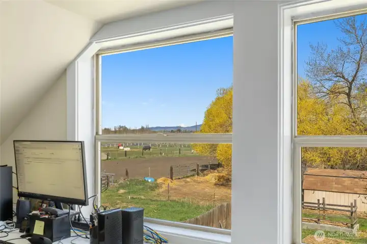How would you love to have an office with a stunning view of the Stuart Mountains and Coleman Creek? Wait no more—this dream workspace is ready for you!