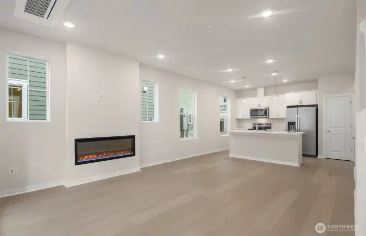 Gathering room with electric fireplace. Similar home shown. Gathering room with electric fireplace. Similar home shown.