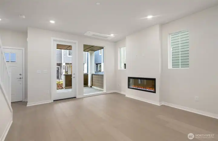 Gathering room and covered front porch. Similar home shown. Gathering room and covered front porch. Similar home shown.