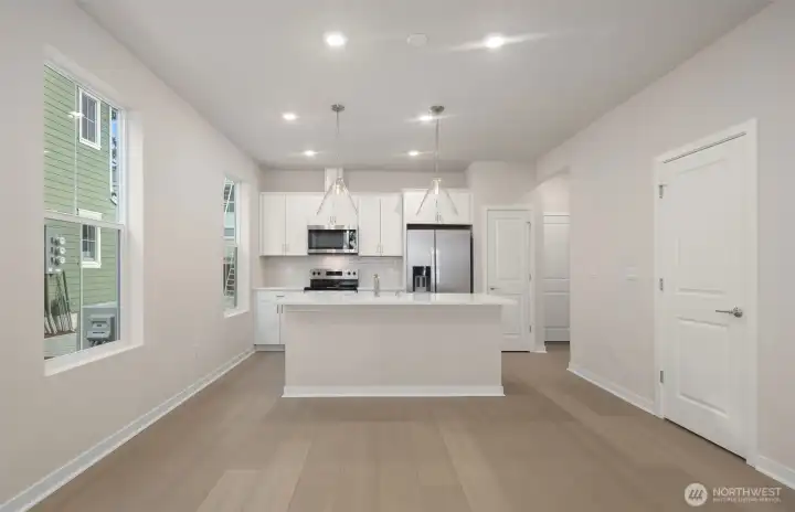 Cafe area and kitchen. Similar home shown. Cafe area and kitchen. Similar home shown.