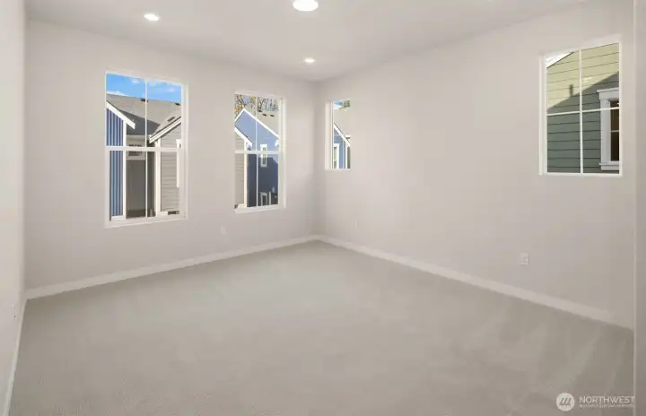 Primary bedroom with extra windows. Similar home shown. Primary bedroom with extra windows. Similar home shown.