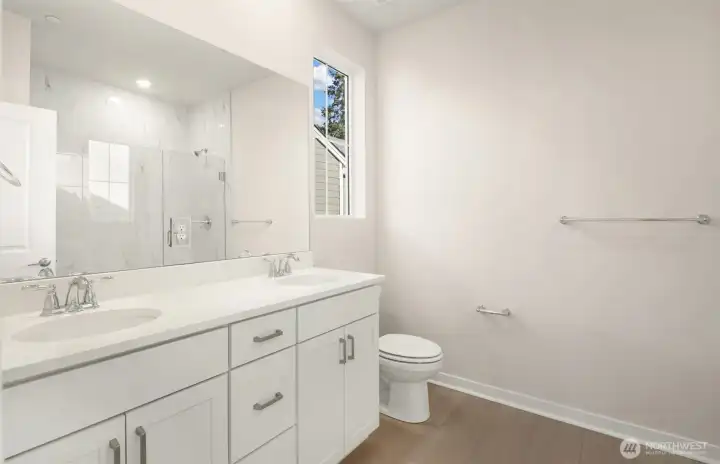 Primary bath with over-sized shower with bench. Similar home shown. Primary bath with over-sized shower with bench. Similar home shown.