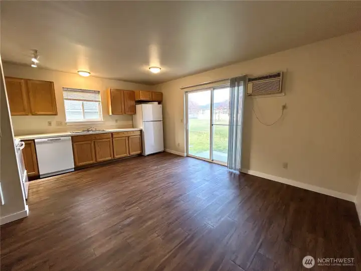 Kitchen and dining area leading to backyard patio