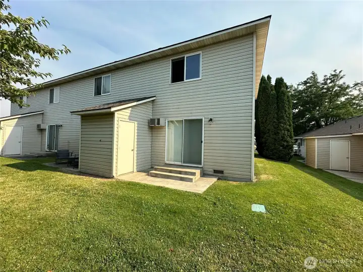 Backyard and patio area with convenient storage for each unit