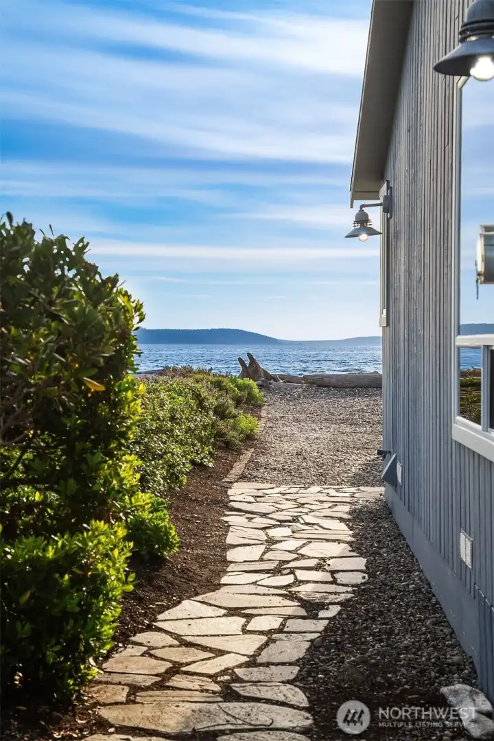 Waterfront stone pathway with mature natural landscape. Waterfront stone pathway with mature natural landscape.