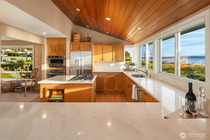 Quartzite countertips, a kitchen island with a propane gas cooktop and abundant cabinet storage. Quartzite countertips, a kitchen island with a propane gas cooktop and abundant cabinet storage.