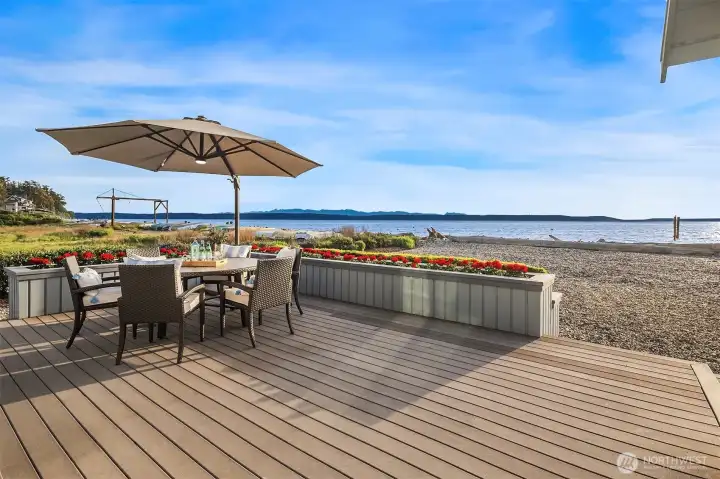 Expansive beachfront decking with beautiful natural landscaping. Expansive beachfront decking with beautiful natural landscaping.