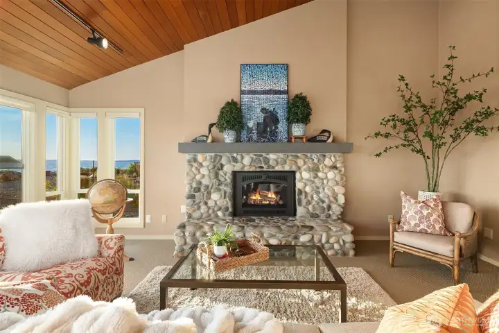 River rock propane fireplace elevates the beachfront ambiance. River rock propane fireplace elevates the beachfront ambiance.