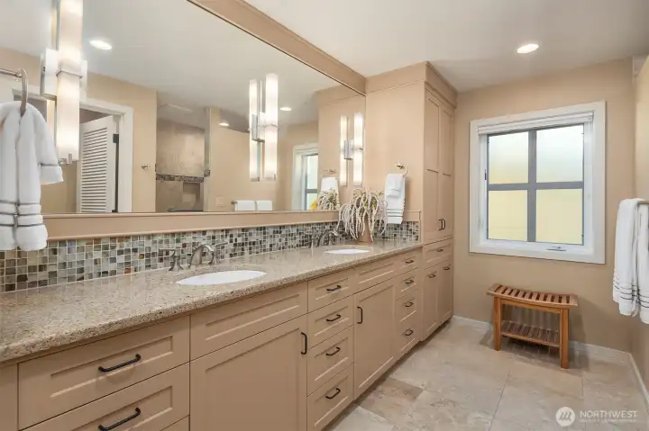 Prmary dual sink/vanity with tile flooring and quartz countertop with abundant shaker style cabinets. Prmary dual sink/vanity with tile flooring and quartz countertop with abundant shaker style cabinets.
