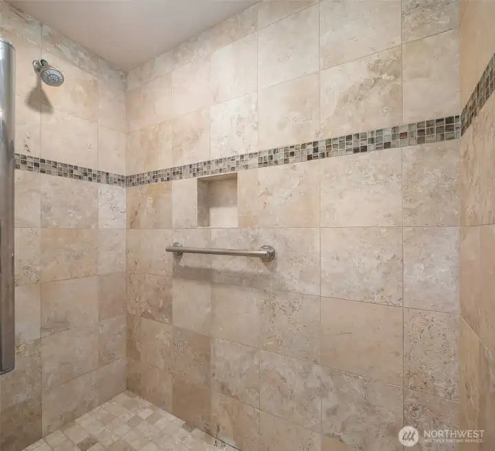 Walk in shower with tile surround. Walk in shower with tile surround.