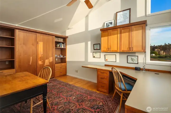 Bonus room/office with vaulted ceiling, built in desk/cabinets, and built in Murphy bed for extra guest space. Bonus room/office with vaulted ceiling, built in desk/cabinets, and built in Murphy bed for extra guest space.