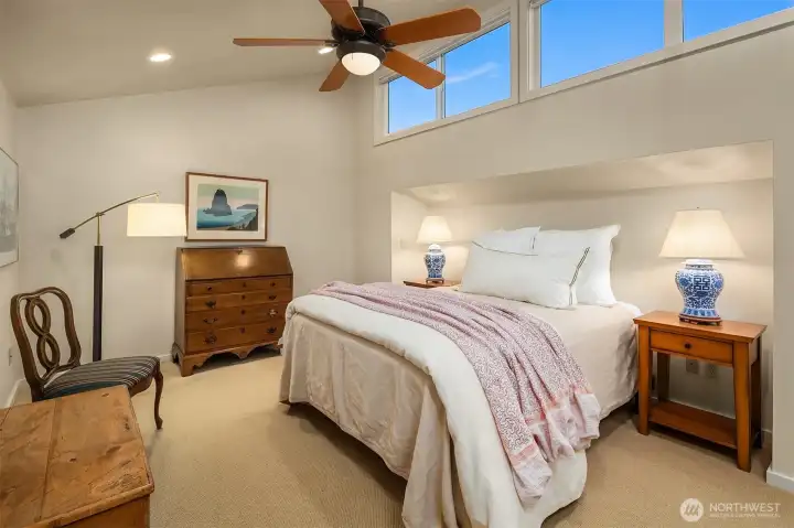 3rd Bedroom with vaulted ceiling, fan, and upper windows for natural light as well as, an ensuite bathroom. 3rd Bedroom with vaulted ceiling, fan, and upper windows for natural light as well as, an ensuite bathroom.