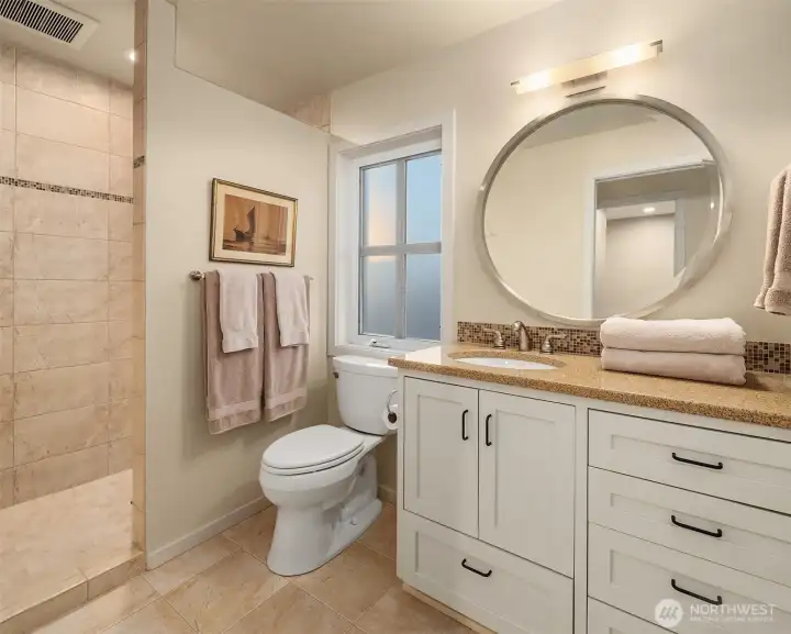 3rd ensuite bathroom with walk-in shower, tile surround, quartz countertops and shaker cabinets. 3rd ensuite bathroom with walk-in shower, tile surround, quartz countertops and shaker cabinets.