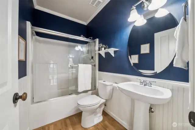 Full bathroom located on the main floor just off the living areas & kitchen and adjacent to the office.