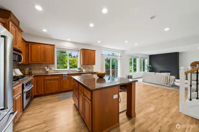 NEWLY refinished hardwood floors throughout kitchen, nook, foyer, dining area & full bath on main level.