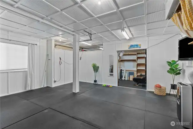 Attached 2 car garage converted to a gym/ storage space (could be converted back to a garage)