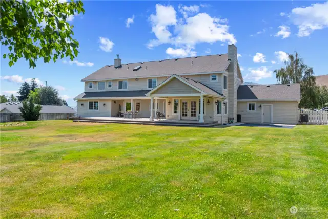 Beautiful backyard with huge patio & covered back porch.