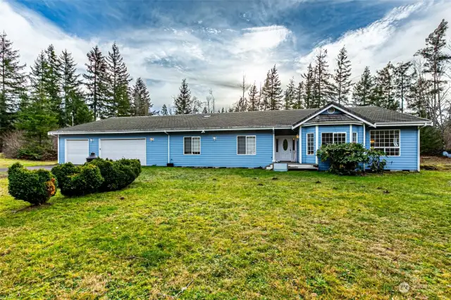 Front of house 3bd 2 bath 2690 sq ft home featuring 8 car drive through garage