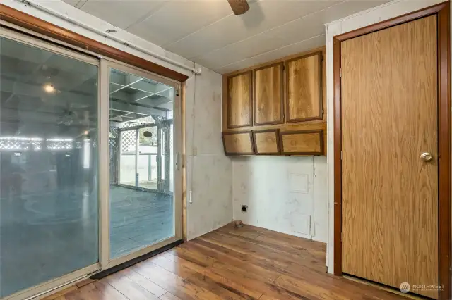 Utility area opposite the wet bar with tons of storage