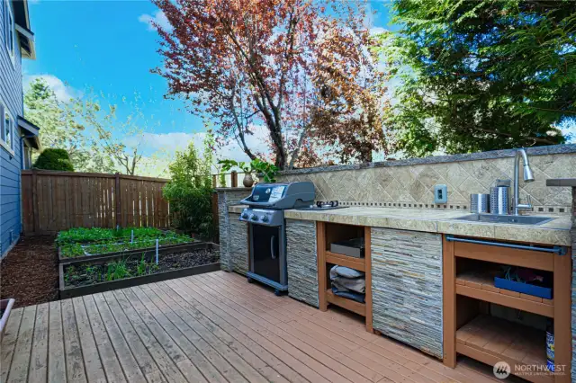 Customer built outdoor kitchen and raised plant bed for garden lovers