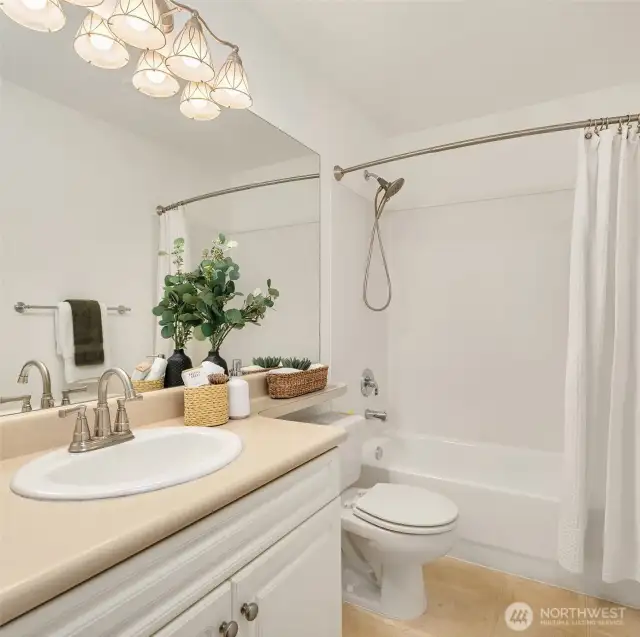 The full bathroom in the hallway supports guests + the other bedrooms.