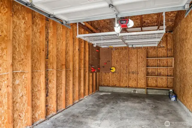 The garage offers extra overhead and tool storage.