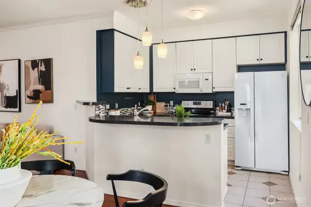 The kitchen is well-appointed and opens to the living room for easy conversation.