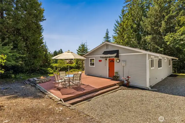 Entrance to the large mud room w/utility sink, storage, washer/dryer, and tile floors.